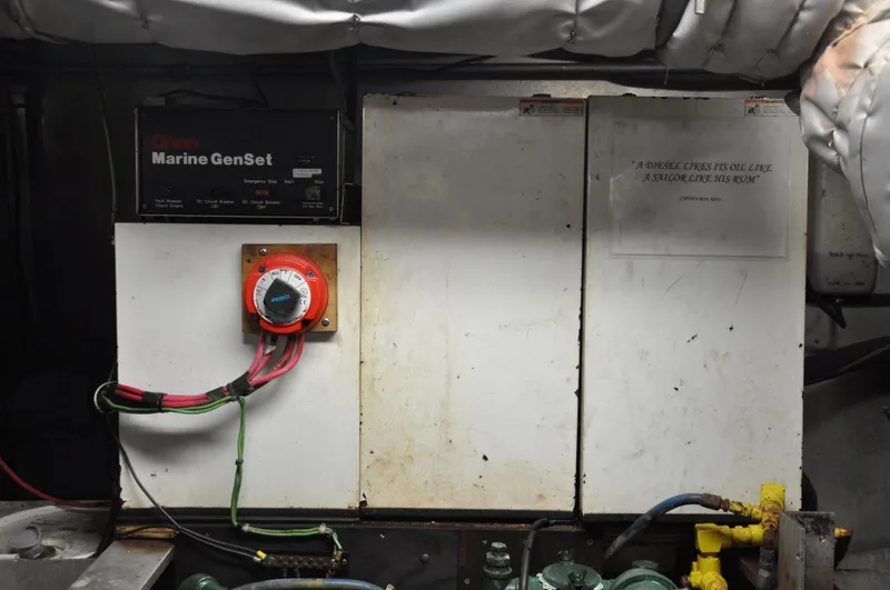 Slide: The Image of Engine room of 1999 Rodriquez 50 Pilothouse with Marine GenSet and wiring. - 34