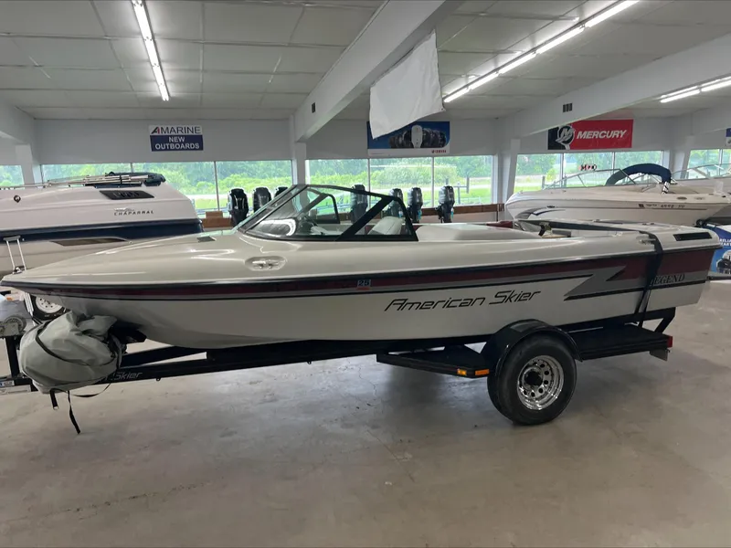 Slide: The Image of 1990 American Skier Legend boat on trailer in showroom. - 2