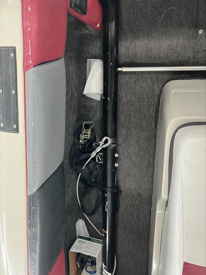 Slide: The Image of Interior of a 1990 American Skier Legend boat with red and gray upholstery. - 7