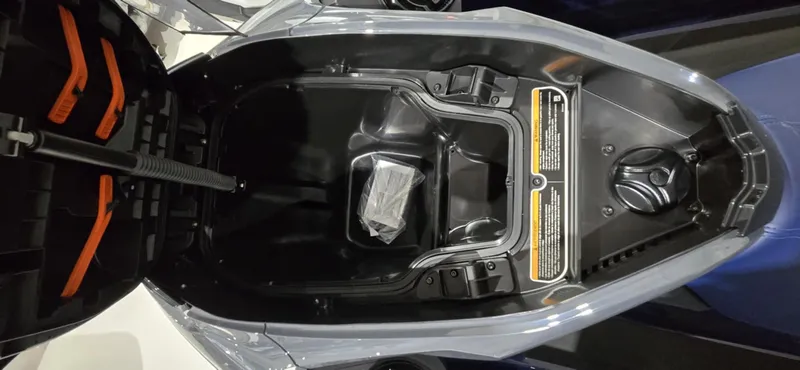 Slide: The Image of Open storage compartment of 2025 Sea-Doo GTX 230 watercraft, showcasing interior space. - 5