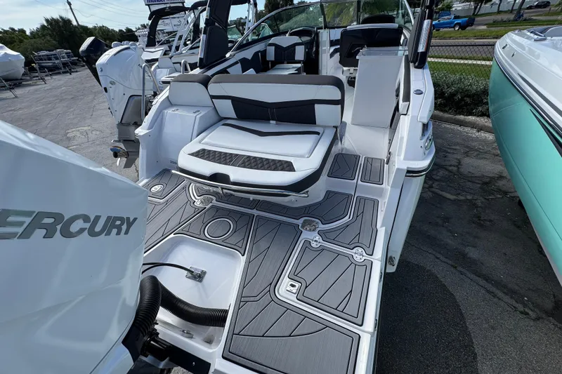 Slide: The Image of 2025 Monterey 255SS boat with sleek seating and modern deck design. - 2