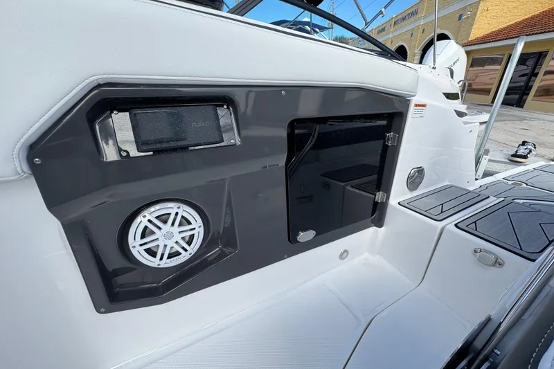 Slide: The Image of 2025 Monterey 255SS boat interior with speaker and storage compartment. - 3