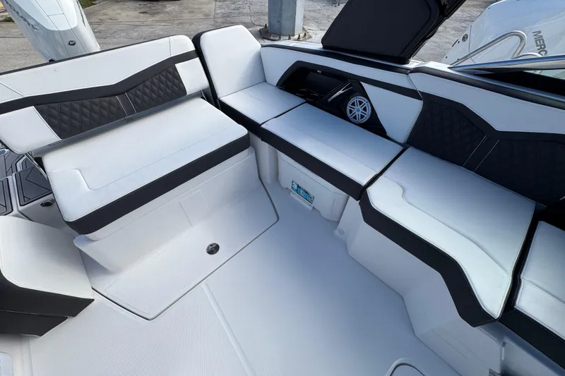 Slide: The Image of Luxurious seating area on 2025 Monterey 255SS boat, featuring sleek black and white upholstery. - 4