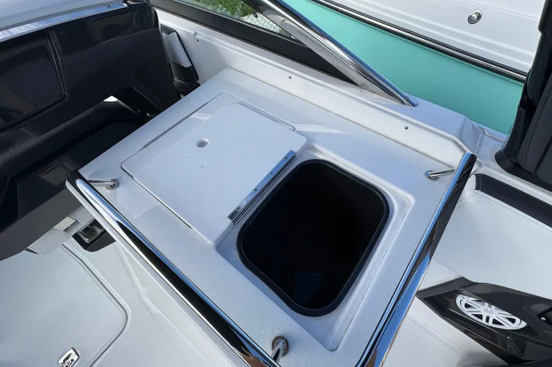 Slide: The Image of 2025 Monterey 255SS boat interior with storage compartment and sleek design. - 8