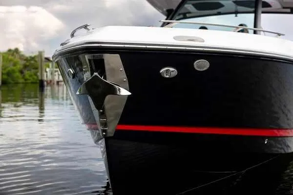 Slide: The Image of 2026 Monterey Elite 30 OB boat on calm water, featuring sleek design and modern details. - 18