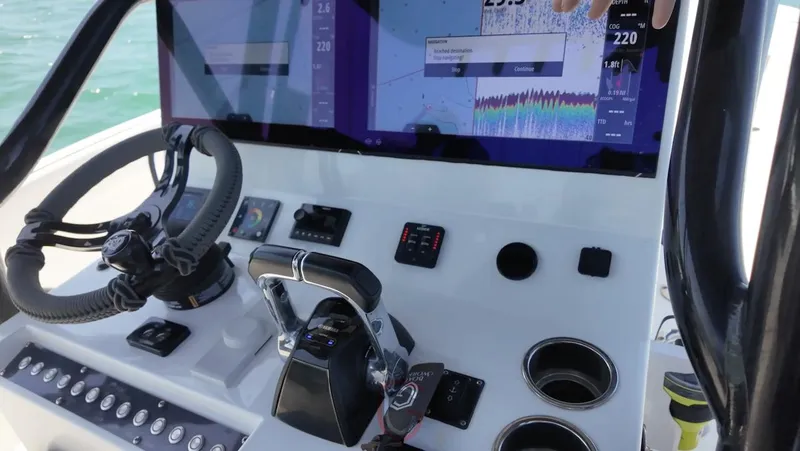 Slide: The Image of 2023 CG Boat Works 35 M-Series dashboard with advanced navigation controls and displays. - 14