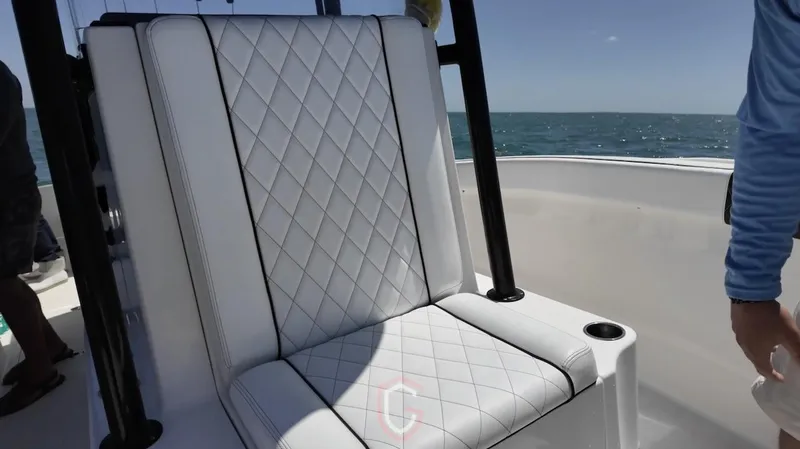Slide: The Image of Luxurious seating on 2023 CG Boat Works 35 M-Series, featuring diamond-stitched upholstery. - 17