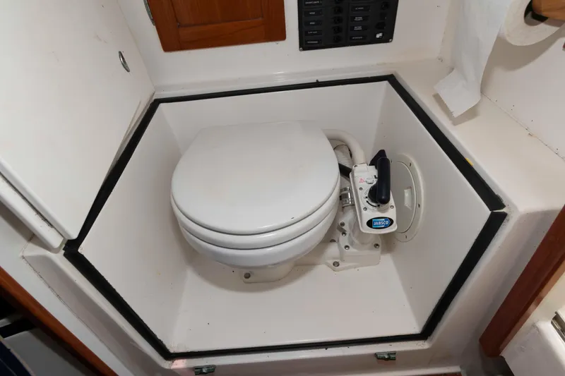 Slide: The Image of Marine toilet in a 2005 Holby Pilot 24 boat bathroom. - 16