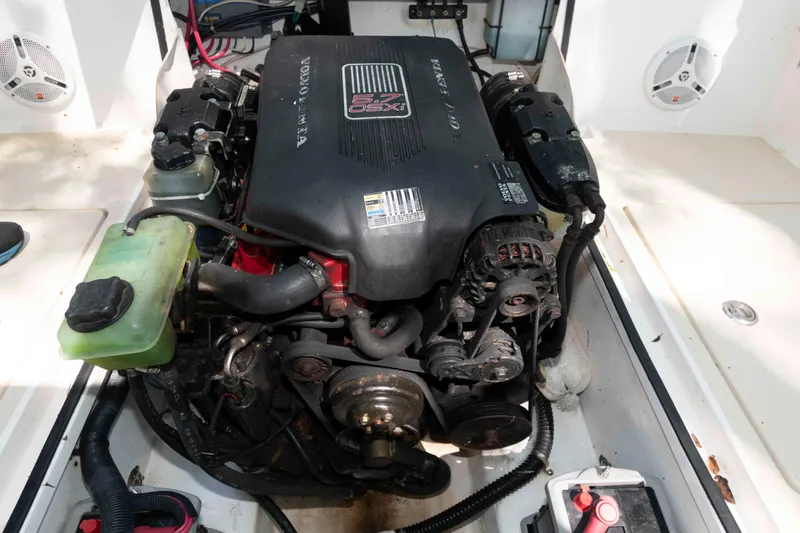 Slide: The Image of Engine compartment of a 2005 Holby Pilot 24 boat, featuring a 5.7 GXI engine. - 17