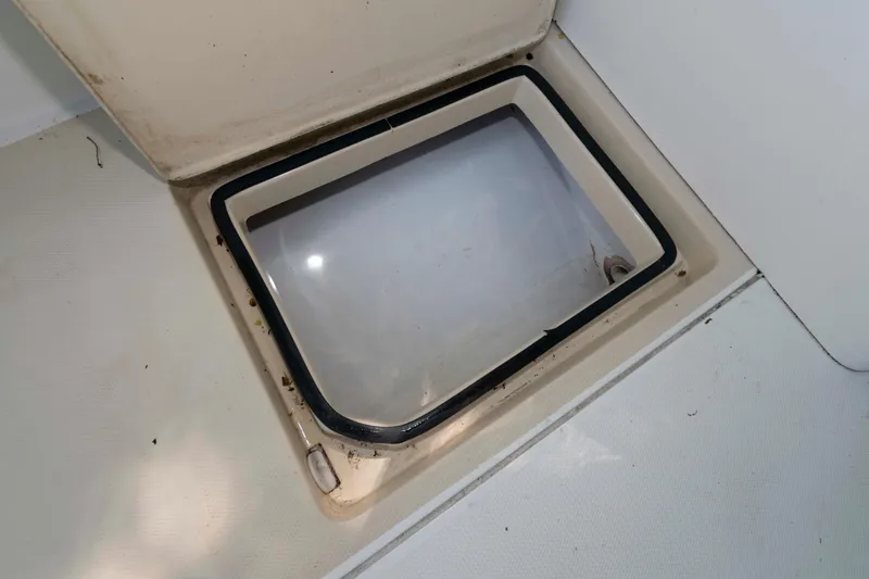 Slide: The Image of Open hatch on Holby Pilot 24 boat, 2005 model, showing interior compartment. - 23