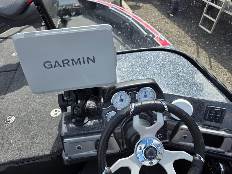 Slide: The Image of Steering wheel and Garmin display on 2025 Nitro ZV-20 SPORT boat dashboard. - 10