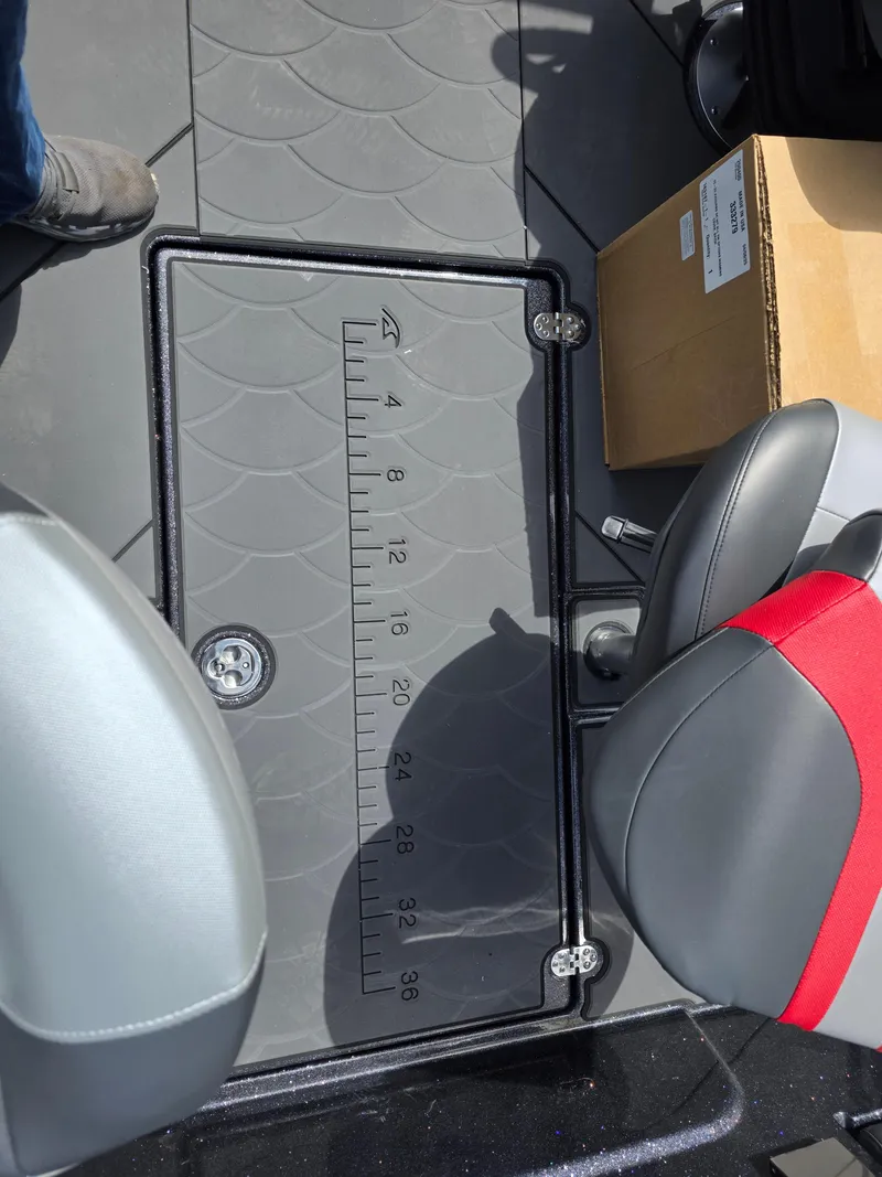 Slide: The Image of 2025 Nitro ZV-20 SPORT boat interior with measuring ruler and seating. - 11