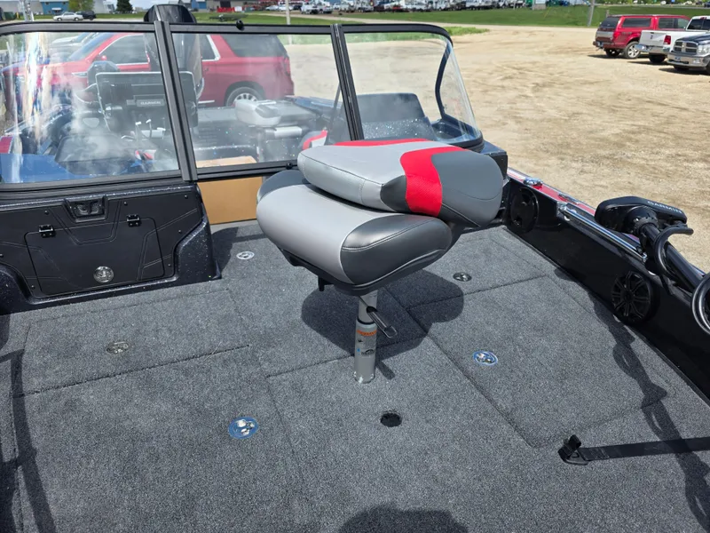 Slide: The Image of 2025 Nitro ZV-20 SPORT boat interior with gray and red seating on a carpeted deck. - 9
