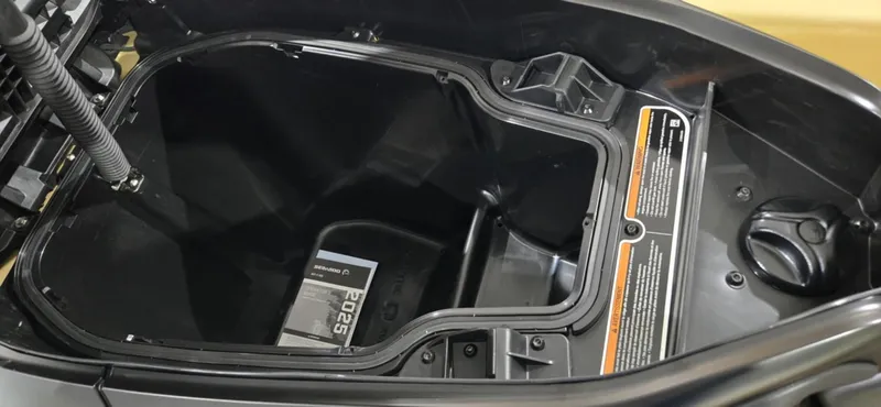 Slide: The Image of Storage compartment of 2025 Sea-Doo RXT-X 325 watercraft, open and empty. - 6