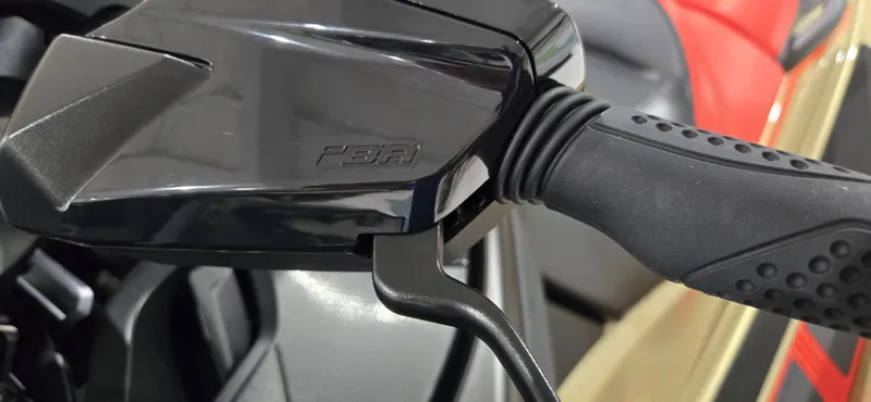 Slide: The Image of Close-up of 2025 Sea-Doo RXT-X 325 handlebar with ergonomic grip design. - 7