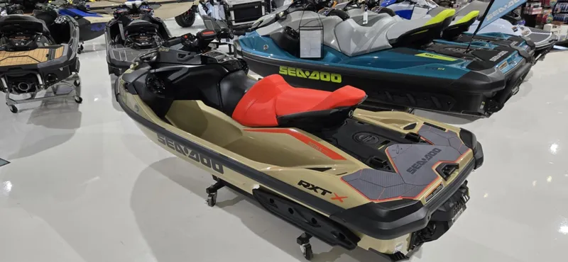 Slide: The Image of 2025 Sea-Doo RXT-X 325 jet ski with red seat, displayed in showroom. - 8