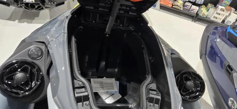 Slide: The Image of 2025 Sea-Doo RXT-X 325 storage compartment open, showcasing interior space. - 4