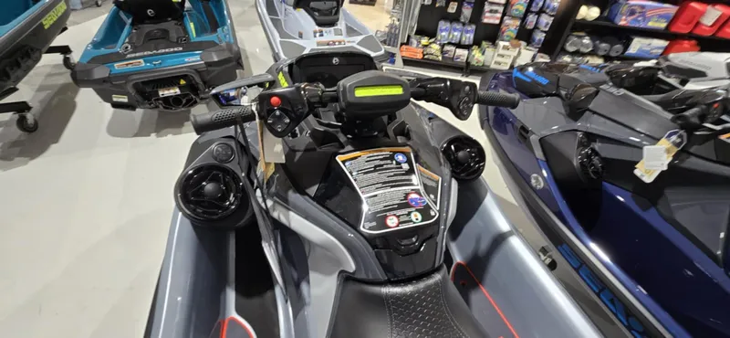 Slide: The Image of 2025 Sea-Doo RXT-X 325 jet ski, showroom display, top view of handlebars and controls. - 5