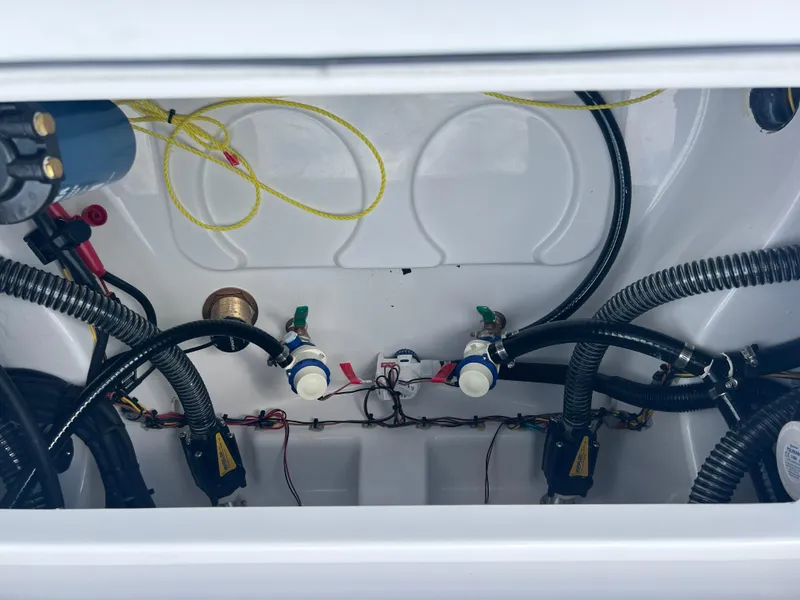 Slide: The Image of 2025 Sportsman Masters 247OE Bay Boat interior wiring and plumbing details. - 21