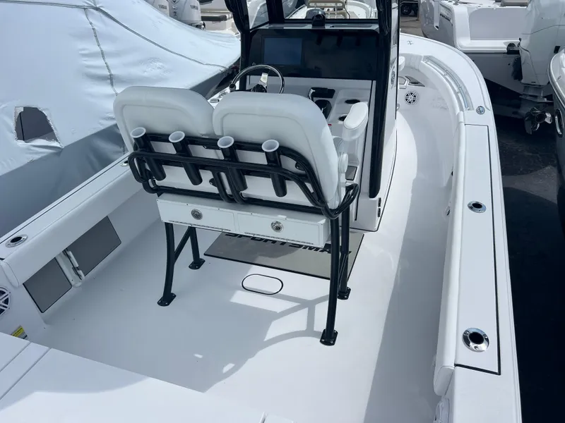Slide: The Image of 2025 Sportsman Masters 247OE Bay Boat interior with dual seats and console. - 7