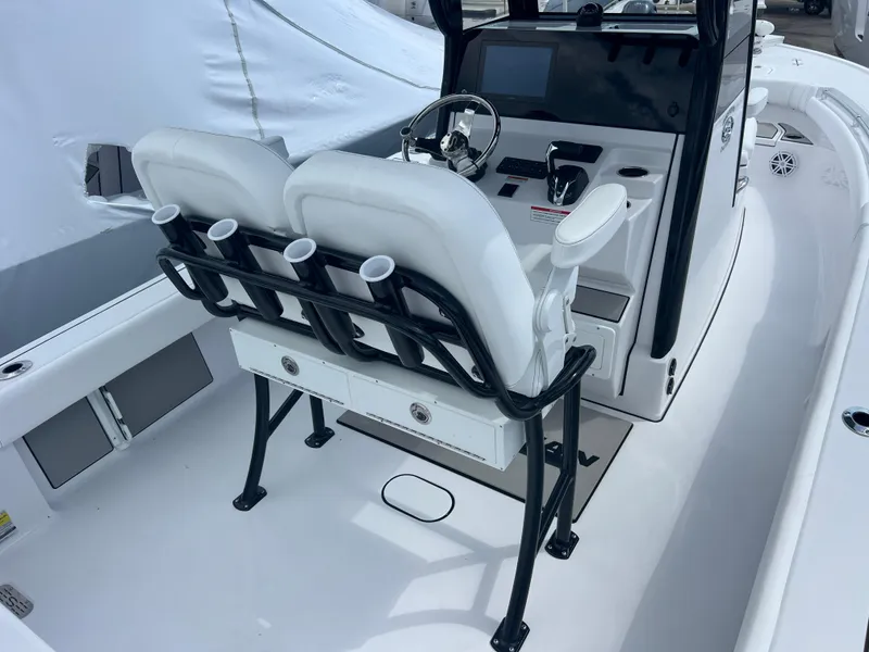 Slide: The Image of 2025 Sportsman Masters 247OE Bay Boat interior with dual seats and modern console. - 8