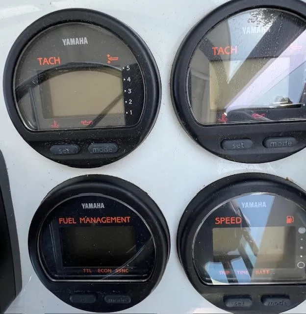 Slide: The Image of Yamaha gauges on 2002 Glacier Bay 2690 Coastal Runner dashboard, showing tachometer and fuel management. - 21