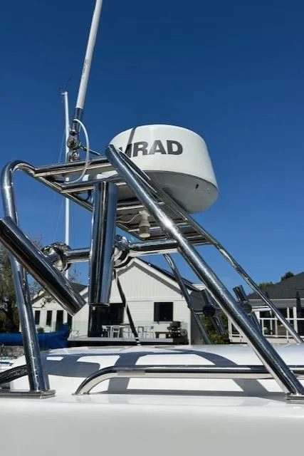 Slide: The Image of 2002 Glacier Bay 2690 Coastal Runner boat radar equipment under clear blue sky. - 3