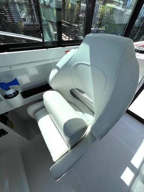 Slide: The Image of Captain's chair on 2002 Glacier Bay 2690 Coastal Runner boat, interior view. - 7