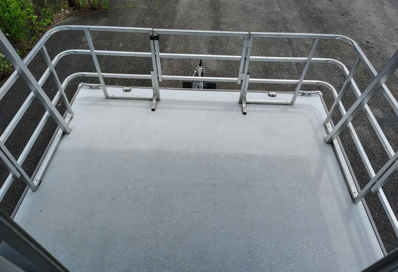 Slide: The Image of 2017 Catamaran Cruisers Lil Hobo 31 deck with metal railings. - 11