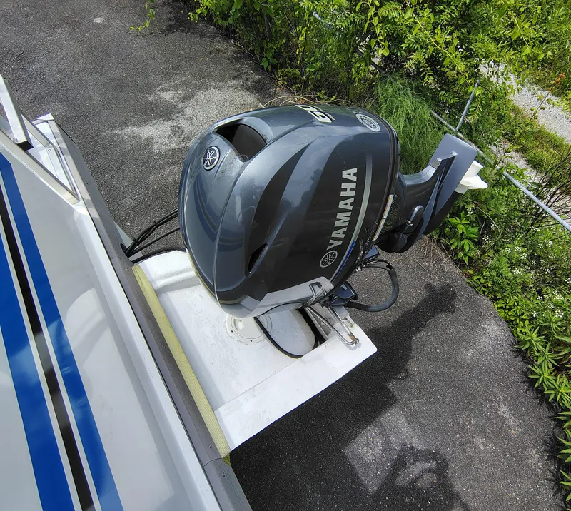 Slide: The Image of Yamaha outboard motor on 2017 Catamaran Cruisers Lil Hobo 31, parked on asphalt. - 12