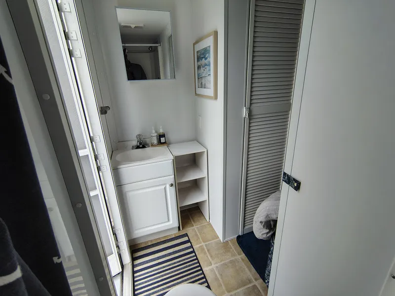 Slide: The Image of Bathroom interior of 2017 Catamaran Cruisers Lil Hobo 31 with sink and storage. - 20