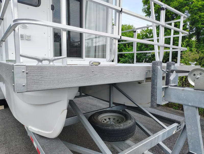 Slide: The Image of 2017 Catamaran Cruisers Lil Hobo 31 on trailer, featuring deck and railing. - 7