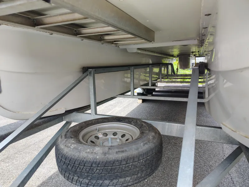 Slide: The Image of Underneath view of a 2017 Catamaran Cruisers Lil Hobo 31 on a trailer. - 8