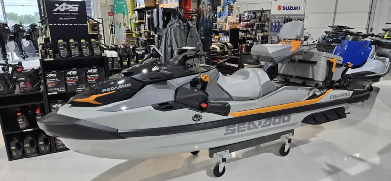 The Image of 2025 Sea-Doo Fishpro Trophy 170 jet ski displayed in a showroom with accessories. - 0