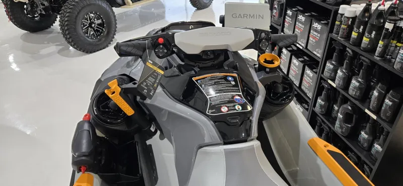 Slide: The Image of 2025 Sea-Doo Fishpro Trophy 170 jet ski with Garmin navigation, displayed in a showroom. - 3