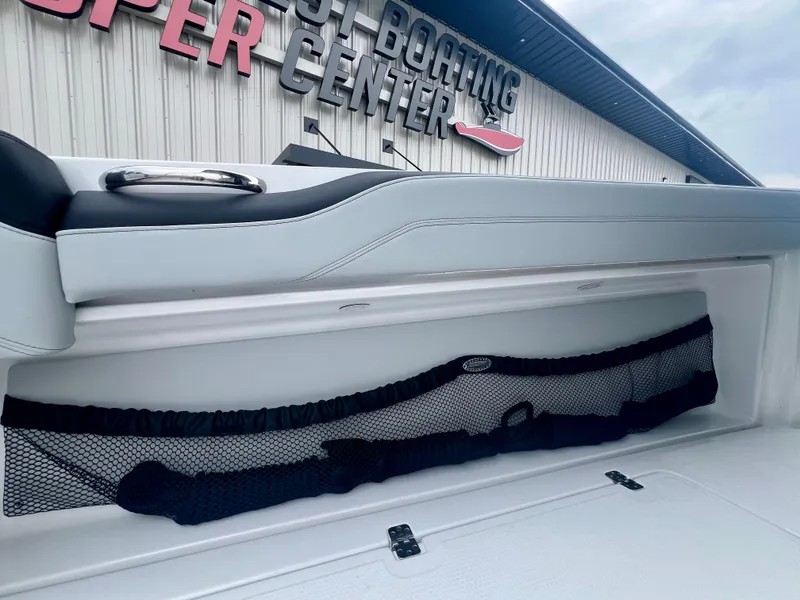 Slide: The Image of 2025 Nor-Tech 340 Sport Center Console storage compartment at a boating center. - 12