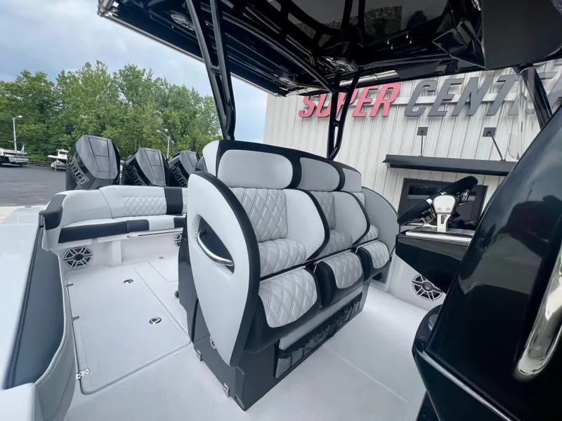 Slide: The Image of 2025 Nor-Tech 340 Sport Center Console boat with luxurious seating and modern design. - 17