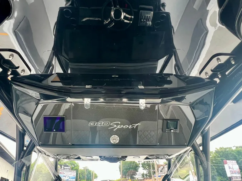 Slide: The Image of 2025 Nor-Tech 340 Sport Center Console dashboard with sleek design and modern controls. - 24