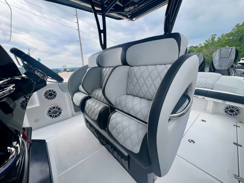 Slide: The Image of 2025 Nor-Tech 340 Sport Center Console interior with luxurious seating and modern design. - 25