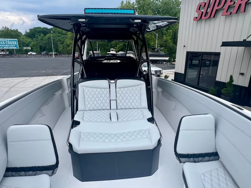 Slide: The Image of 2025 Nor-Tech 340 Sport Center Console boat with sleek seating and modern design. - 27