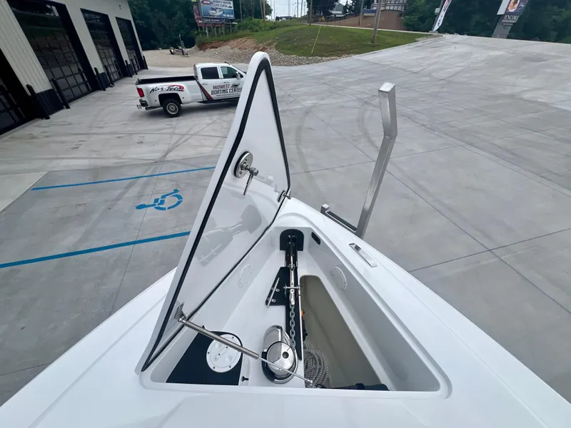 Slide: The Image of 2025 Nor-Tech 340 Sport Center Console boat with open anchor compartment. - 30