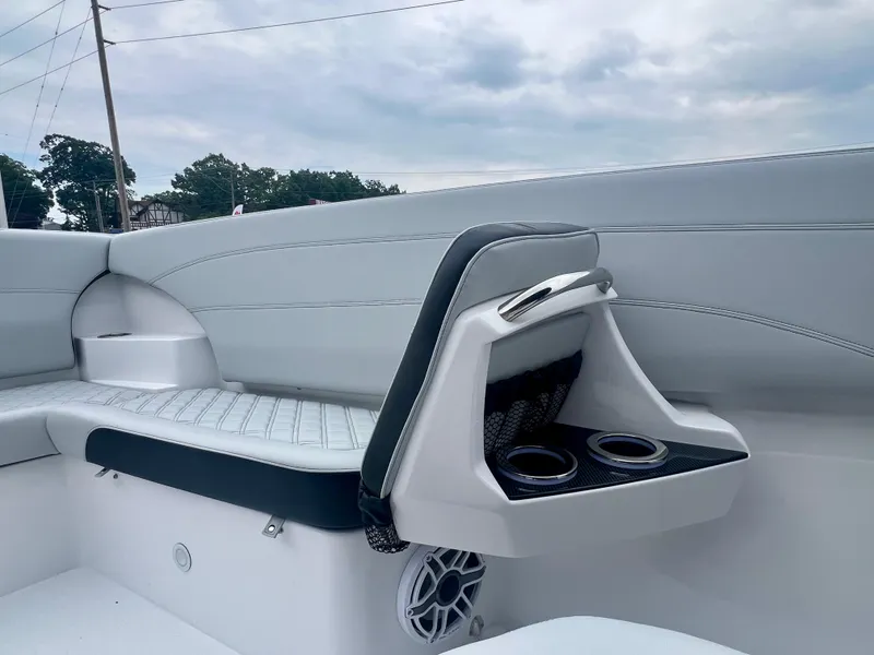 Slide: The Image of 2025 Nor-Tech 340 Sport Center Console interior with seating and cup holders. - 35