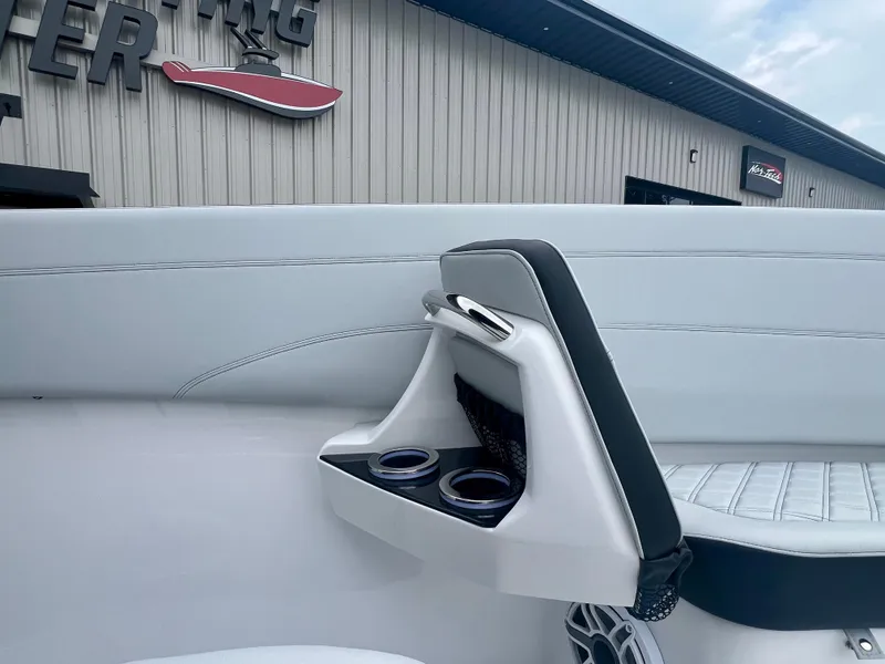 Slide: The Image of 2025 Nor-Tech 340 Sport Center Console interior with cup holders and seating detail. - 36