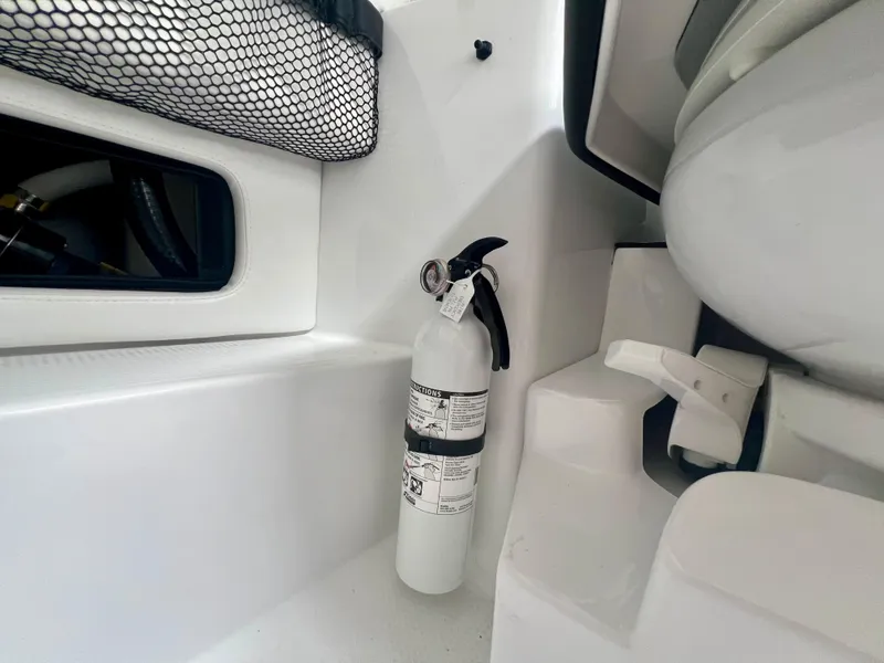 Slide: The Image of Fire extinguisher in 2025 Nor-Tech 340 Sport Center Console boat interior. - 42
