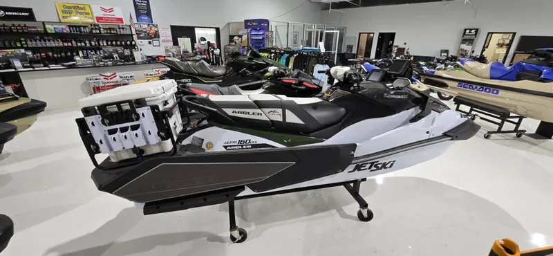 Slide: The Image of 2025 Kawasaki Jetski Ultra 160 LX-S Angler displayed in showroom, featuring sleek design and fishing accessories. - 4