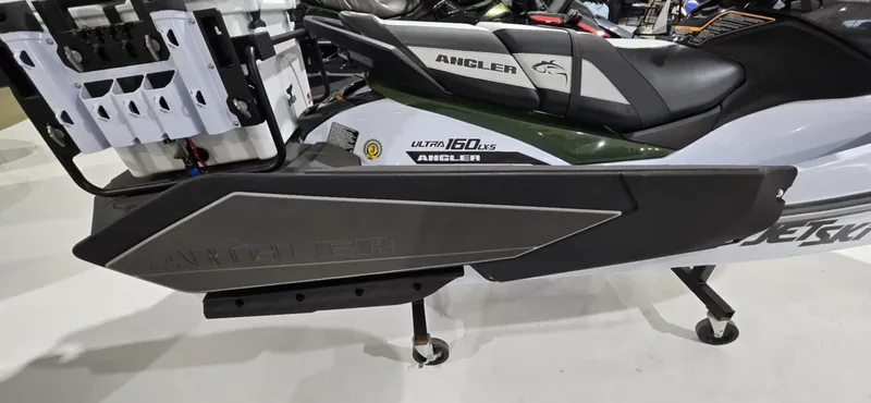 Slide: The Image of 2025 Kawasaki Jetski Ultra 160 LX-S Angler, side view, featuring sleek design and fishing accessories. - 7