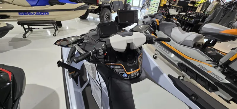 Slide: The Image of 2025 Kawasaki Jetski Ultra 160 LX-S Angler displayed in showroom with other watercraft. - 9