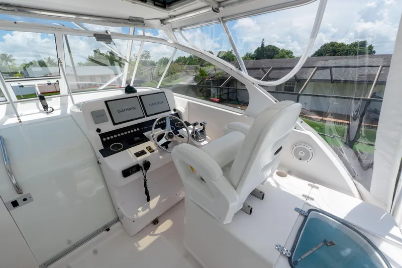 Slide: The Image of 2007 Pro-Line 35 Express boat cockpit with modern navigation equipment and comfortable seating. - 10