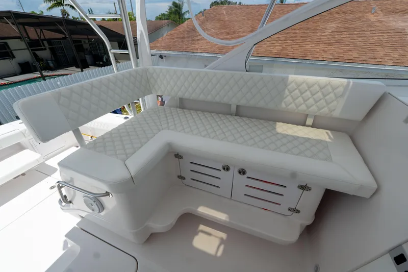 Slide: The Image of Luxurious seating area on a 2007 Pro-Line 35 Express boat with quilted upholstery. - 13