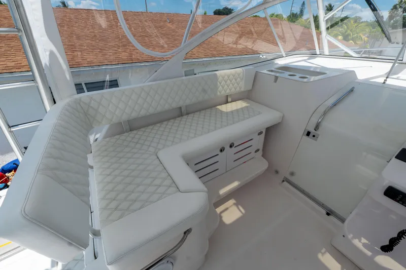 Slide: The Image of 2007 Pro-Line 35 Express boat interior with white quilted seating and modern design. - 14